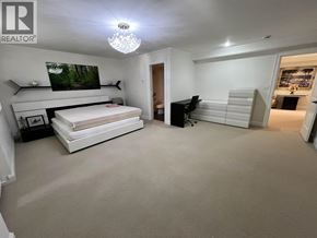Vancouver apartment for rent - A bedroom with a bed, a desk, and a chair.