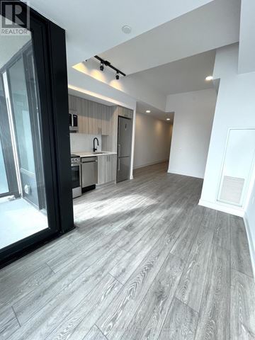 Toronto (Dovercourt-Wallace Emerson-Junction) condo for rent - A spacious kitchen with a view of the dining area.