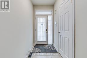 Oakville (Wm Westmount) townhouse for rent - A hallway with a door and a mat on the floor.