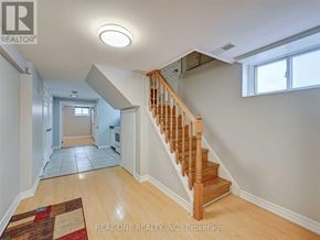 Toronto (Clanton Park) apartment for rent - A hallway with a staircase leading to the second floor.