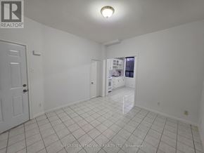 Toronto (Dovercourt-Wallace Emerson-Junction) apartment for rent - A white room with a door and a window.