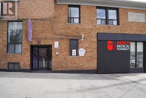 Toronto (East End-Danforth) multi-family for rent - A brick building with a sign that says Ritchie's Dairy.