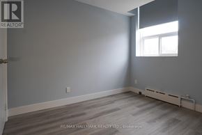 Toronto (East End-Danforth) multi-family for rent - A room with a window and a door leading to another room.