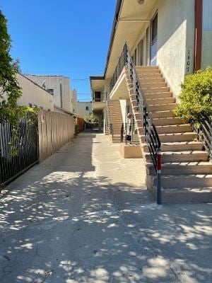 Los Angeles apartment for rent - A narrow alley with a staircase leading to a building.