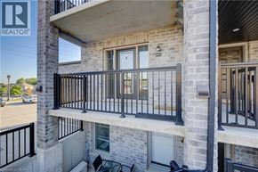 Kitchener townhouse for rent - A balcony of a building with a REALTOR® logo.