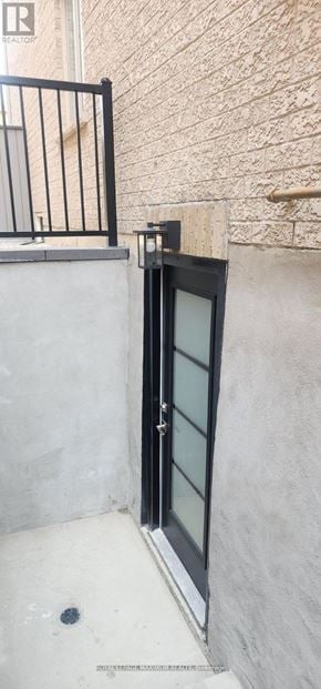 Vaughan apartment for rent - A black door with a glass window is closed.