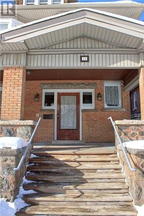 Hamilton (Blakeley) apartment for rent - A house with a red door and a stone wall.