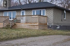 Woodstock (Woodstock - North) apartment for rent - A house with a grey facade and a wooden deck.