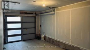 Welland (Dain City) townhouse for rent - A room with a door and a sign that says "REALTOR".