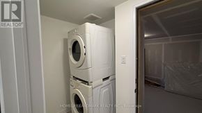 Welland (Dain City) townhouse for rent - A room with white walls and a concrete floor.