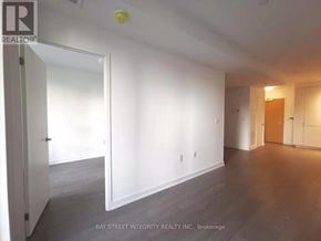 Toronto (Bay Street Corridor) condo for rent - A room with white walls and a door on the left.