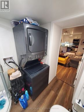 Toronto (Corso Italia-Davenport) fourplex for rent - A small room with a TV and a toilet.