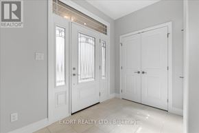 Quinte West (Murray Ward) townhouse for rent - A white interior with a door and a window.
