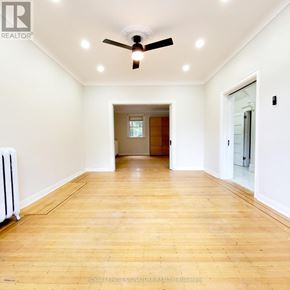 Hamilton (Stipley) multi-family for rent - A room with a ceiling fan and wooden flooring.