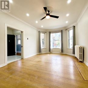 Hamilton (Stipley) multi-family for rent - A room with a ceiling fan and hardwood floors.