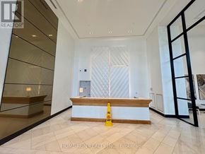 Ottawa condo for rent - A yellow caution cone is placed in front of a reception desk in a modern office.