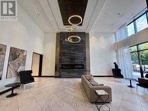 Ottawa condo for rent - A modern living room with a fireplace and a large painting on the wall.