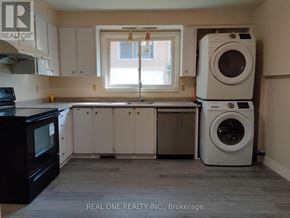 Markham (Bullock) apartment for rent - A laundry room with a washer and dryer stacked on top of each other.