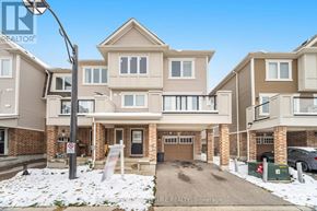Kitchener house for rent - A row of houses with a no parking sign in front.
