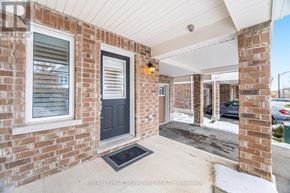 Kitchener house for rent - A brick house with a black door and a window.
