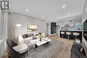 Guelph (St. George's) apartment for rent - A modern living room with a grey and white color scheme.