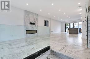 Toronto (Caledonia-Fairbank) apartment for rent - A spacious living room with a marble floor and a fireplace.