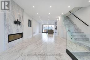 Toronto (Caledonia-Fairbank) apartment for rent - A spacious hallway with marble floors and a staircase.