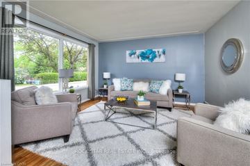 Cambridge apartment for rent - A living room with a grey couch, a coffee table, and a painting on the wall.