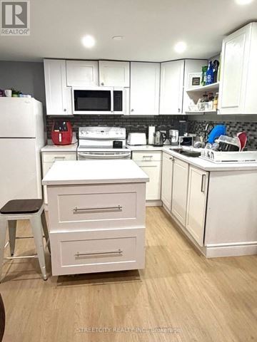 London North (North F) apartment for rent - A kitchen with white cabinets and appliances.