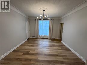 Windsor apartment for rent - A room with wooden flooring and a large window with curtains.