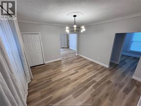 Windsor apartment for rent - A room with wooden flooring and a white door.