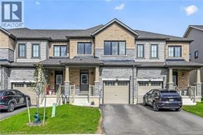 Caledonia townhouse for rent - A large, well-maintained house with a car parked in front.