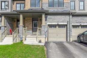 Caledonia townhouse for rent - A house with a garage and a car parked in front.