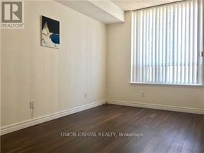 Toronto (Willowdale East) condo for rent - A room with wooden flooring and a picture on the wall.