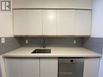 Toronto (Willowdale East) condo for rent - A kitchen with a sink and a dishwasher.