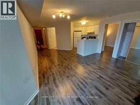 Toronto (Newtonbrook East) condo for rent - A room with wooden flooring and a white kitchen island.