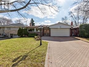 Toronto (Woburn) apartment for rent - A house with a driveway and a garage door numbered 62.