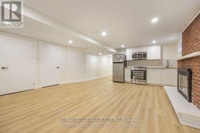 Toronto (Tam O'shanter-Sullivan) apartment for rent - A spacious kitchen with wooden flooring and modern appliances.