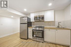 Toronto (Tam O'shanter-Sullivan) apartment for rent - A kitchen with white cabinets and a stainless steel refrigerator.