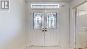 Georgina (Keswick South) apartment for rent - A white double door with a glass panel and stained glass design.
