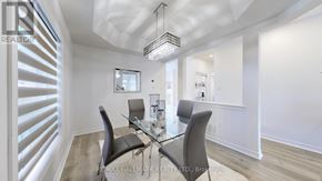 Georgina (Keswick South) apartment for rent - A dining room with a glass table and chairs.