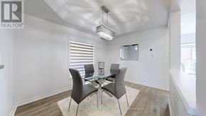 Georgina (Keswick South) apartment for rent - A dining room with a glass table and chairs.