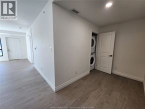 Windsor condo for rent - A room with a washer and dryer in it.