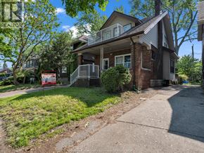 Windsor apartment for rent - A house with a red sign in front of it.