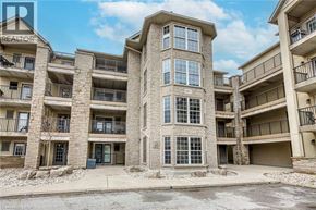 Burlington condo for rent - A building with a balcony and a blue trash can in front of it.