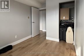 London North (North G) condo for rent - A room with a door and a closet with a suitcase in it.