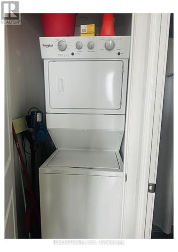 Mississauga (Central Erin Mills) condo for rent - A white Whirlpool oven and dishwasher combo in a small kitchen.
