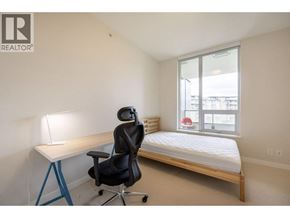 Vancouver apartment for rent - A bedroom with a bed, desk, and chair.
