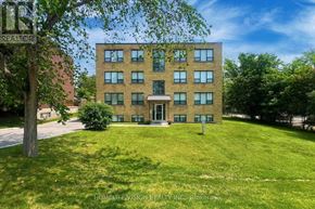 Richmond Hill (Harding) multi-family for rent - A building with a lawn in front of it.