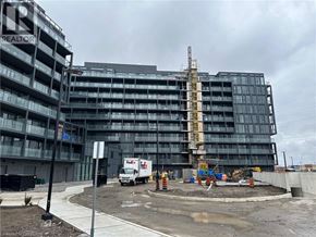 Burlington condo for rent - A large building under construction with a FedEx truck parked in front.